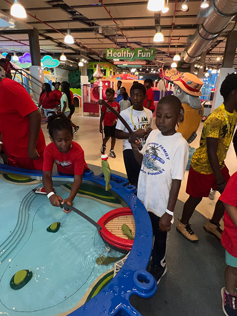 children playing a fishing game